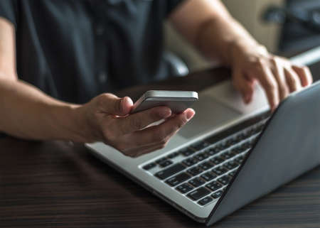 Digital lifestyle blog writer or business person using smart device working on internet communication technologyの写真素材