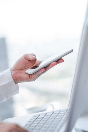 Digital lifestyle blog writer or business person using smart devices working on internet communication technologyの写真素材