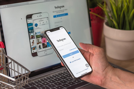 BANGKOK, THAILAND - December 29, 2018: Instagram social media app logo on log-in, sign-up registration page on mobile app screen on iPhone smart devices in business person's hand at workのeditorial素材
