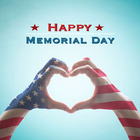 Happy memorial day with America flag pattern on people hands in heart shape isolated on mint sky backgroundの写真素材