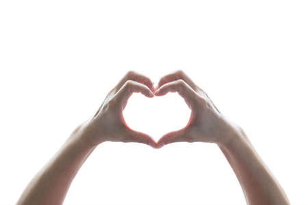 Isolated woman hands in heart shape on white background