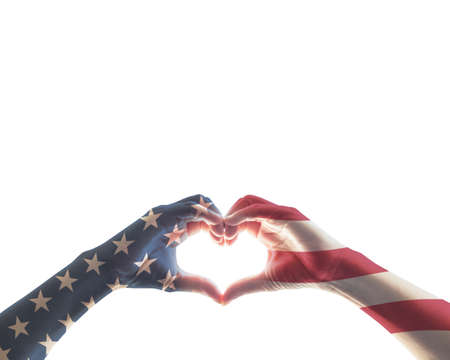 American flag red white blue star pattern on people hands in heart love shape isolated on white background: USA patriot, veterans, independence, Columbus day, constitution and citizenship day conceptの写真素材