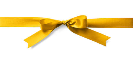 Gold satin ribbon stripe fabric bow isolated on white backgroundの写真素材