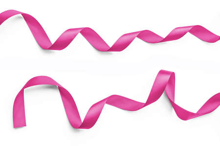 Shiny satin ribbon in sweet valentines pink rose fuchsia color isolated on white backgroundの写真素材