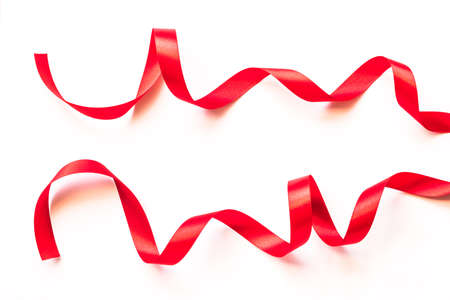 Red bow ribbon satin texture isolated on white background