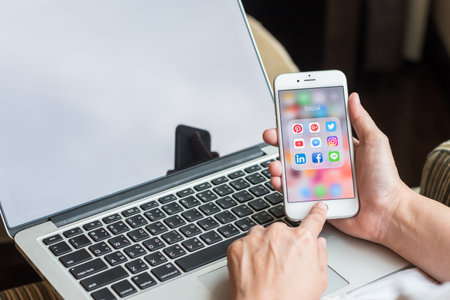 BANGKOK, THAILAND - January 08, 2017: Social media app icons on Iphone 7 screen smartphone with mobile internet network computer technology for people digital 4.0 lifestyle.のeditorial素材