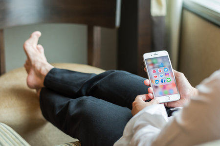 BANGKOK, THAILAND - January 08, 2017: Social media app icons on Iphone 7 screen smartphone with mobile internet network technology for people digital 4.0 lifestyle.のeditorial素材