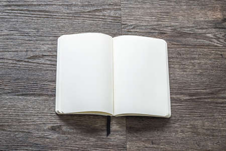 Mock up blank open pocket book, catalog, magazine, brochure note template paper texture in corner on table desk or floorの写真素材