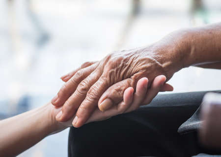 Parkinson disease patient, elderly senior person in support of nursing family caregiver for...