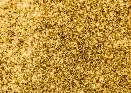 Gold glitter texture sparkling shiny wrapping paper background for Christmas holiday seasonal wallpaper  decoration, greeting and wedding invitation card design elementの写真素材