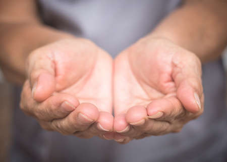 Charity donation concept with grandparent or old woman person's empty hands in asking or receiving...