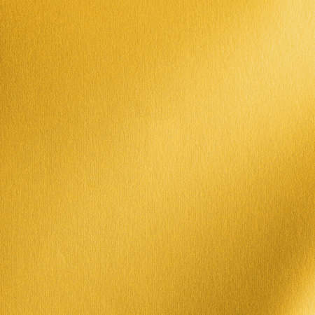 Gold background metallic golden foil or shinny wrapping paper bright yellow wall paper leather texture for design decoration elementの写真素材