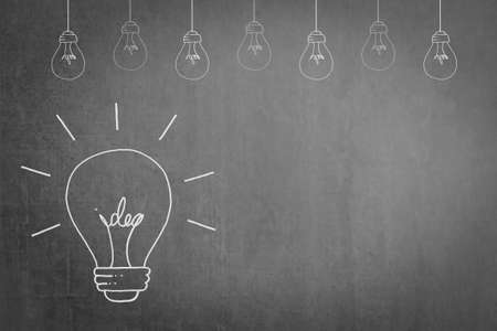 Educational or business creative thinking idea concept on success with lightbulb doodle on black...