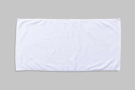 White beach towel mock up isolated with clipping path on grey background, flat lay top view