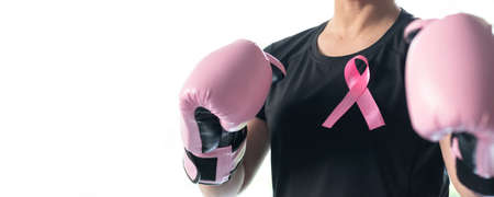 Breast cancer awareness pink ribbon for women health in October month, female patient fighting with tumor on white backgroundの写真素材