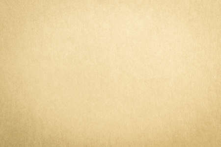 Recycled paper texture background in yellow cream color toneの写真素材