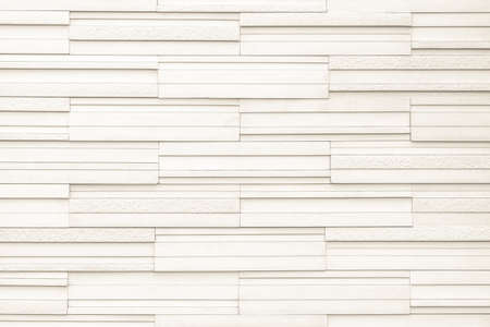 Granite tiled wall detailed pattern texture background in natural light creme beige color