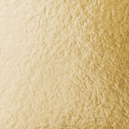 Gold foil leaf shiny wrapping paper texture background for wall paper decoration elementの写真素材