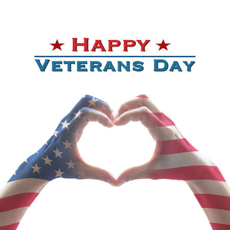 USA Happy veterans day with United States of America flag pattern on people's hands in heart shape greeting announcement honoring all veterans who served American countryの写真素材