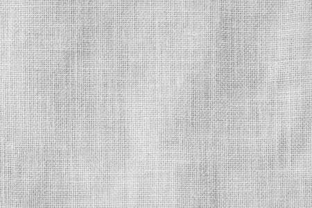 Hessian sackcloth woven texture pattern background in light white gray colorの写真素材