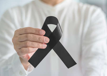 Black Ribbon symbolic bow color raising awareness on Melanoma and skin cancer prevention, sleep ...