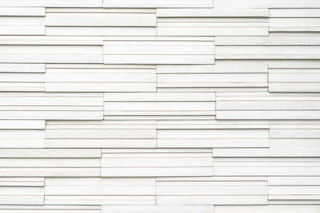 Granite tiled wall detailed pattern texture background in natural light white colorの写真素材