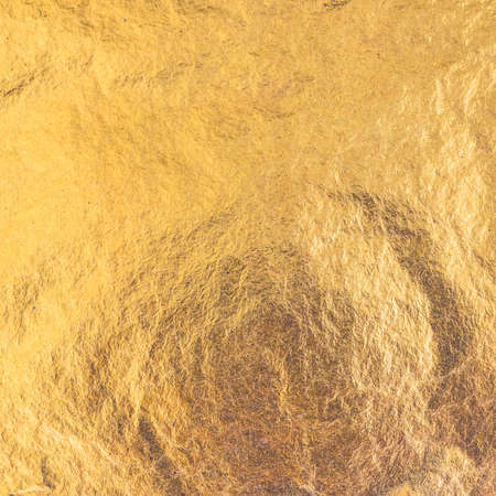 Gold foil leaf metallic wrapping paper texture background for wallpaper decoration element