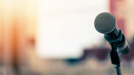 Microphone voice speaker in business seminar, speech presentation, town hall meeting, lecture hall or conference room in corporate or community event for host or townhall public hearingの写真素材