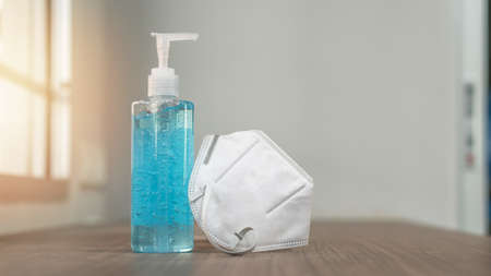 Covid-19 outbreak, coronavirus pandemic prevention with n95 face mask and alcohol gel sanitizer for hand cleaning during quarantine for hygience antibacteria safetyの写真素材