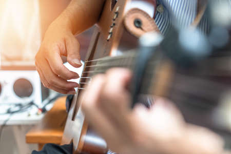 Electric guitar player or guitarlist playing live music show or rehearsal for stag performance or...