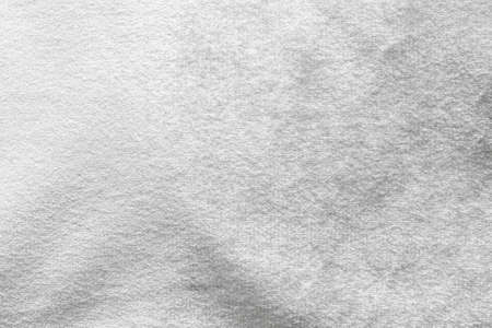 Silver white velvet background or velour flannel texture made of cotton or wool with soft fluffy velvety satin fabric cloth metallic color materialの写真素材