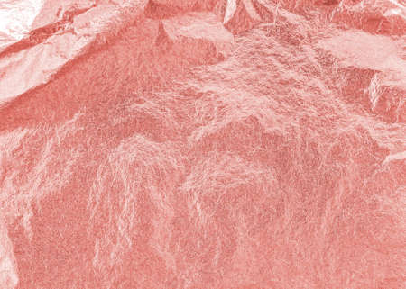 Rose gold pink texture metallic wrapping foil paper shiny metal background for wall paper decoration elementの写真素材