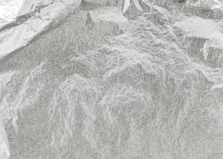 Silver background metallic texture wrapping foil paper shiny white grey metal backdrop for wall paper decoration elementの写真素材