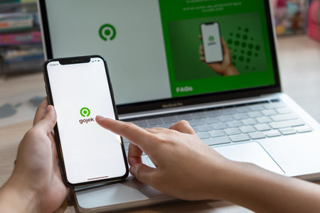Bangkok, Thailand - September 7, 2020: Gojek app on mobile phone with services GoRide, GoSend, GoShop, and GoFood by Indonesian unicorn company operating business in Southeast Asiaのeditorial素材