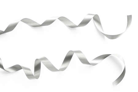 Silver satin ribbon bow scroll set isolated on white background  for Christmas and wedding card design decorationの写真素材