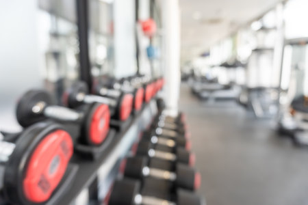 Gym blur background fitness center, workout personal training studio, health club with blurry sports exercise equipment for aerobic, bodybuilding and power strength classの写真素材