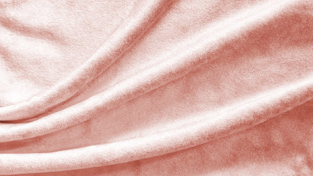 Rose gold pink velvet background or velour flannel texture made of cotton or wool with soft fluffy velvety satin fabric cloth metallic color materialの写真素材