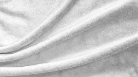 Silver white velvet background or velour flannel texture made of cotton or wool with soft fluffy velvety satin fabric cloth metallic color materialの写真素材