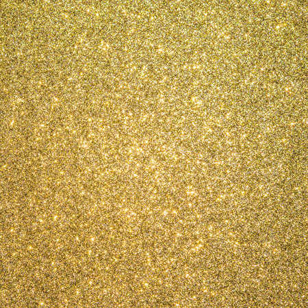 Gold glitter texture background sparkling shiny wrapping paper for Christmas holiday seasonal wallpaper  decoration, greeting and wedding invitation card design elementの写真素材