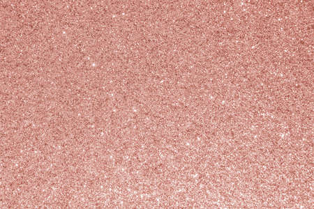 Rose gold glitter texture pink red sparkling shiny wrapping paper background for Christmas holiday seasonal wallpaper decoration, greeting and wedding invitation card design elementの写真素材
