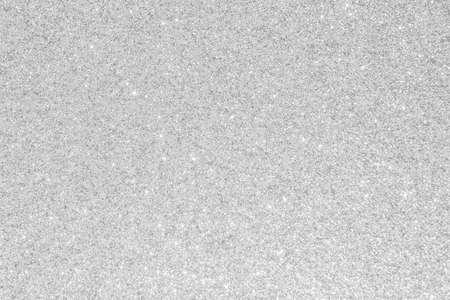 Silver glitter background texture white sparkling shiny wrapping paper for Christmas holiday seasonal wallpaper decoration, greeting and wedding invitation card design elementの写真素材