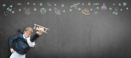 Kid in pilot costume and imagination dream in learning inspiration world in innovative science technology engineering maths STEM education and universal children's day conceptの写真素材