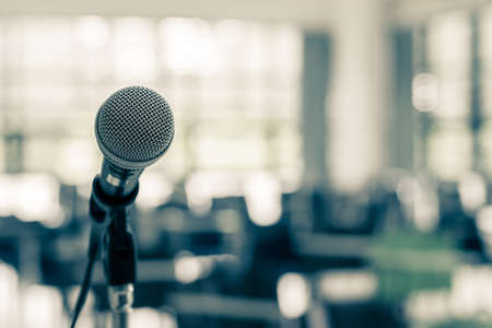 Microphone voice speaker in business seminar, speech presentation, town hall meeting, lecture hall or conference room in corporate or community event for host or townhall public hearingの写真素材