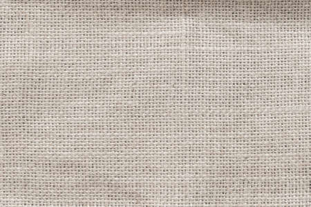 Jute hessian sackcloth woven burlap texture background in sepia cream old aged brown colorの写真素材
