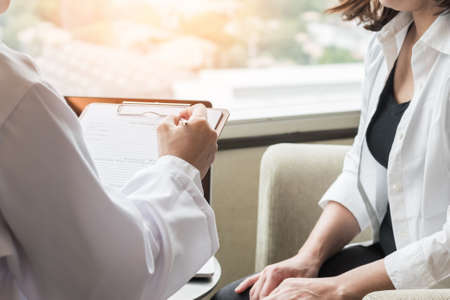 Breast cancer awareness in menopause woman who consulting with doctor diagnostic examining on obstetric - gynaecological female patient illnes and health in medical clinicの写真素材