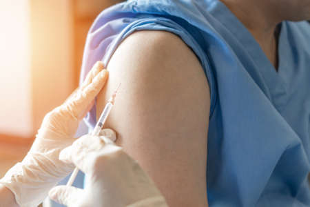 Vaccine for vaccination, medical immunization for adult man or male patient from disease such as covid-19, coronavirus, measles, HPV, Hepatitis B, Hepatitis A, meningitis, pertussis, pneumoniaの写真素材
