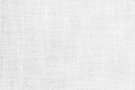 Jute hessian white sackcloth woven burlap texture pattern background in old aged light grey colorの写真素材