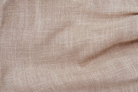 Jute hessian sackcloth woven burlap texture background in sepia cream old aged brown colorの写真素材