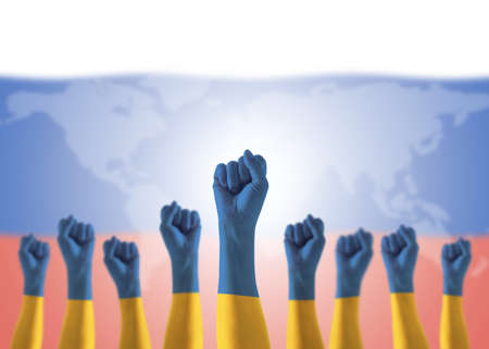 Ukraine flag on Ukrainian people hands for national empowerment and strengthening citizenship fighting for freedom and nation independence from Russian-occupied terriroriesの写真素材