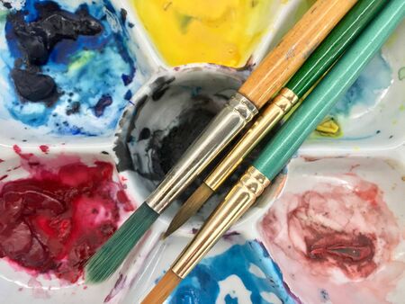 Closeup of brush and color wheelの写真素材